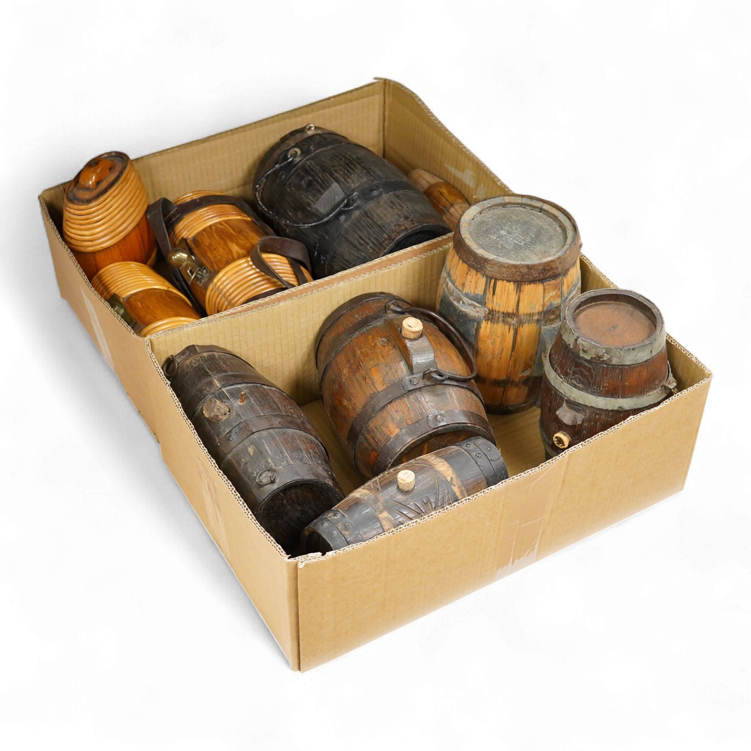 A collection of 19th and 20th century Costrels, some coopered oak, largest 27cm wide